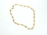 an image of a gold necklace on a white background