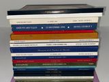 a stack of books sitting on top of each other on a table