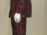 a mannequin dressed in a red and black suit