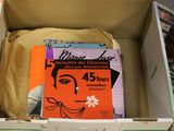 a cardboard box with a book in it on the floor