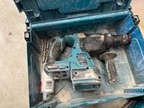 a blue tool box with tools in it on the floor