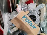 a cardboard box full of tools and other things in it