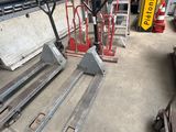 a fork and a pallet in a warehouse