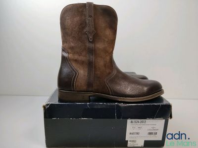 a close up of a pair of brown boots on top of a box