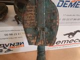 a horse saddle that is on display in front of a box