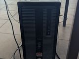 a computer that is sitting on the floor in the room