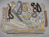a collection of assorted necklaces and bracelets