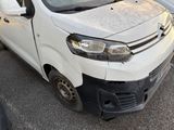 a white van that is parked on the side of the road