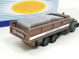 a toy truck that is sitting next to a box