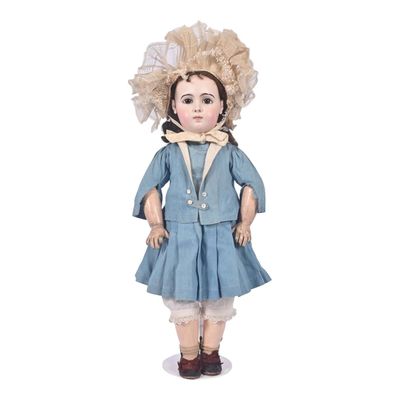 an image of a doll of a girl in a blue dress and hat