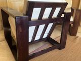 a chair that is sitting on a rug in a room