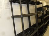 a long shelf with lots of boxes on it in a room