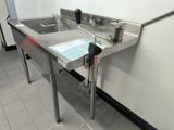 a stainless steel sink in a public restroom