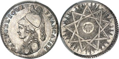 a close up of two silver coins with a star on one side and a star on the other