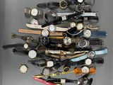 a lot of watches that are stacked on top of each other