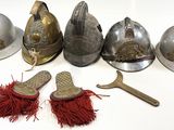 a lot of different types of helmets on the table