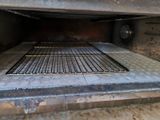 a grill with a grill grate inside of it