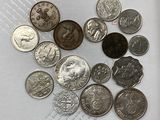 a lot of coins that are sitting on a piece of paper