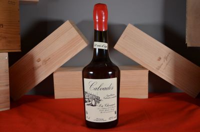 a bottle of wine that is sitting on a table