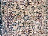 a close up of a rug on a wooden floor