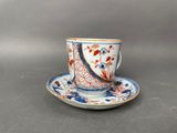 an image of a cup and saucer on a saucer