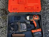 an orange tool kit sitting on top of a black and orange case