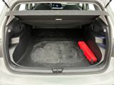 a trunk of a car with a red object in the trunk
