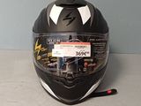 a helmet with a sticker on it sitting on a table