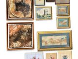 many framed pictures and paintings on the wall