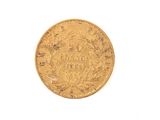 an image of a gold coin on a white surface with a white background