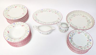 a lot of plates and cups on the table
