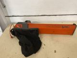 an orange and black electric nailer sitting on top of a table