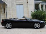 a black convertible car parked in front of a house