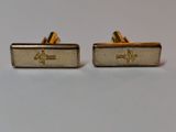 two pairs of gold cufflinks with initials on them