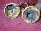 a pair of antique brass goggles sitting on a red cloth