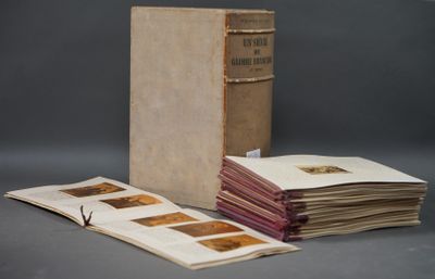 several old books are stacked on top of each other on a table