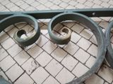 a close up view of a metal gate with two rings on it