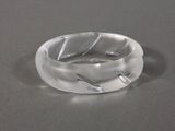 a clear ring that has a leaf design on it