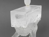 an image of a clear glass candle holder with a candle on top of it