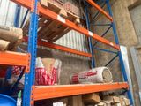 a shelf with a lot of items on it in a warehouse