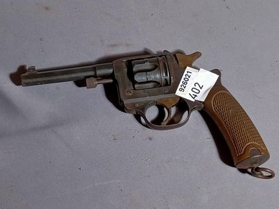 a gun that is on the table with a price tag on it