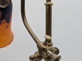 a lamp that is on a pole with a bird on it