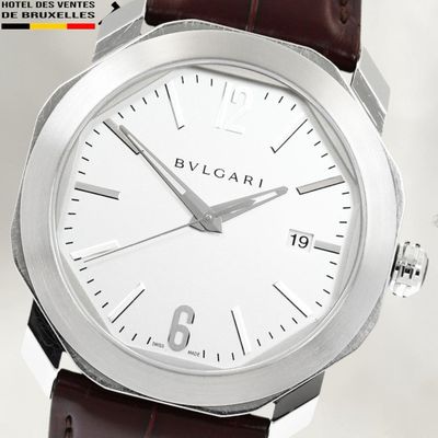 a close up of a wrist watch with a white dial