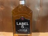 the bottle of labell 5 is sitting on a table