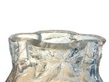 a clear glass vase that is sitting on a table