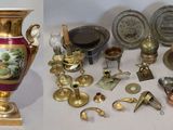 many different types of vases and other items on the table
