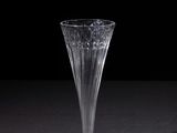 a glass vase that is sitting on a table