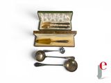 three spoons and two spoon spoons in a case