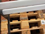 a pile of pallets of wood stacked on top of each other