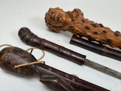 three different types of canes on a white surface